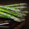 A bunch of asparagus is sitting on the table