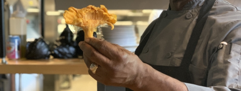 A man holding a bunch of food in his hand.